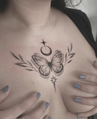 schmetterling brust tattoo